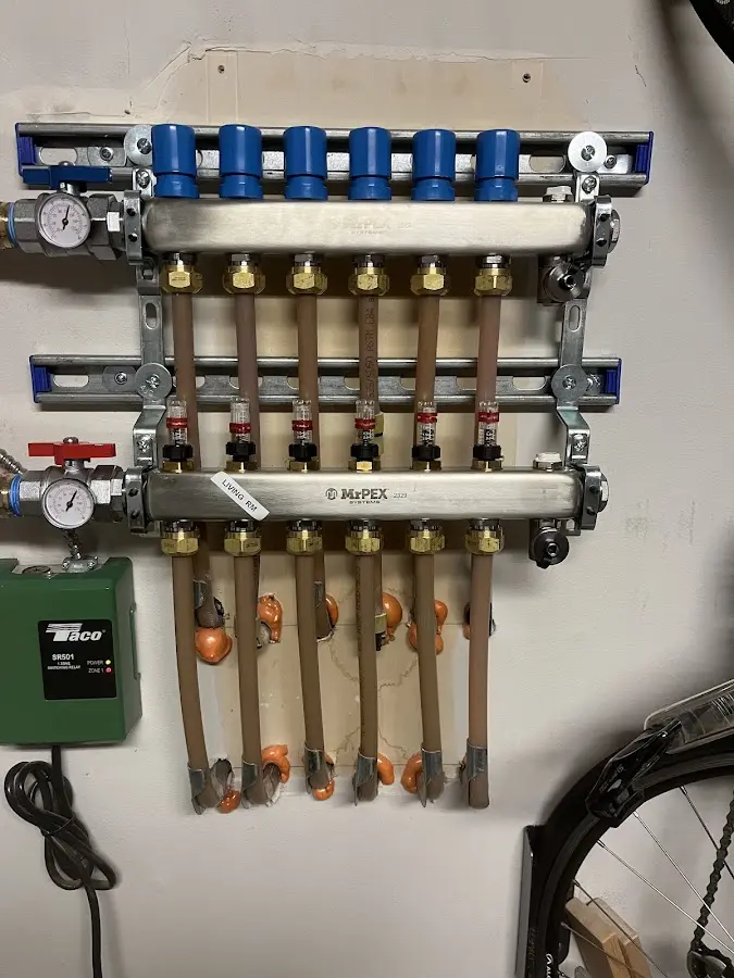 Plumber performing Water Heater Repair at a residential property in Oconto Falls